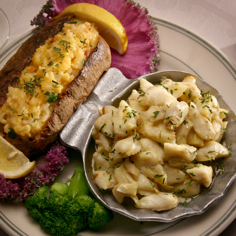 image of jumbo lump crab meat and a baked potato on a plate